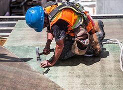 Worker finishing a precast concrete surface on site