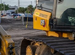 Tracked bulldozer parked on a road construction site